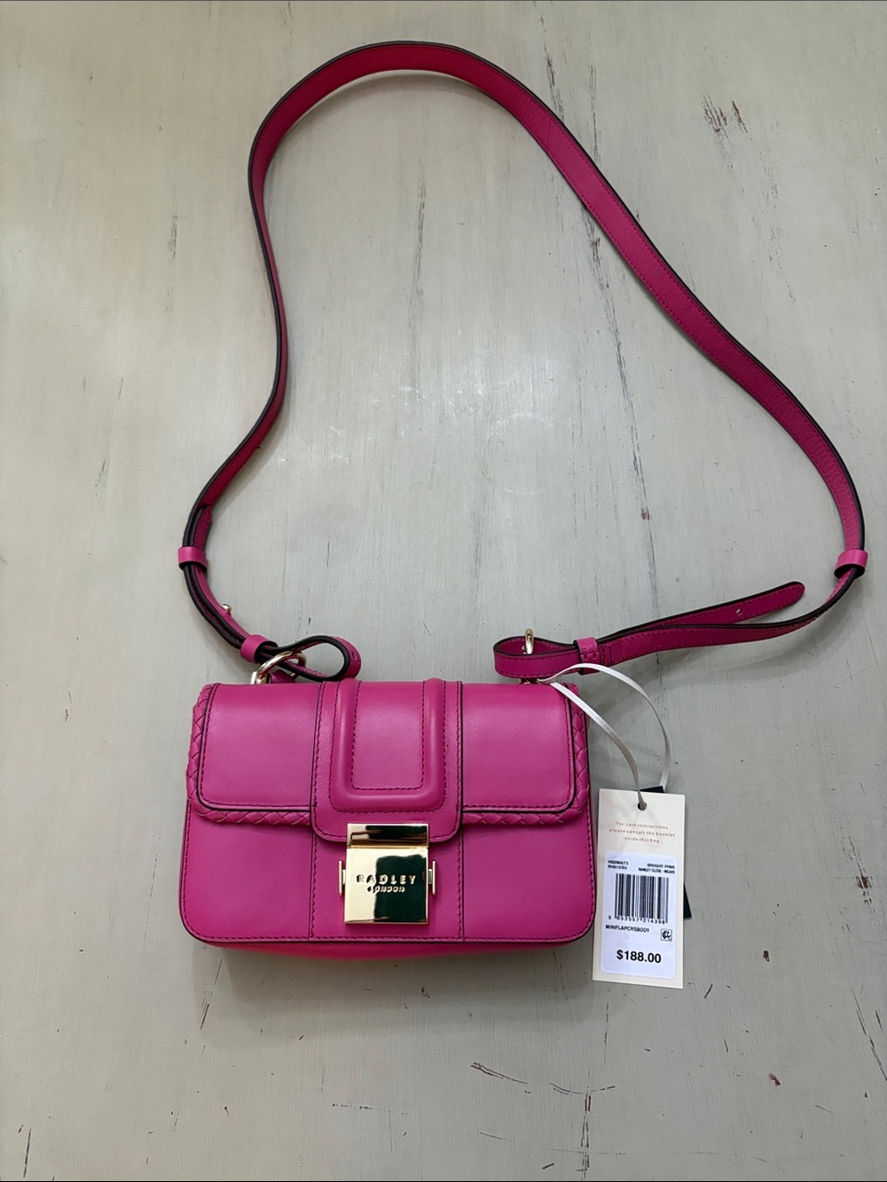 Bradley Womens Pink Leather Crossbody Bag with Gold Lock